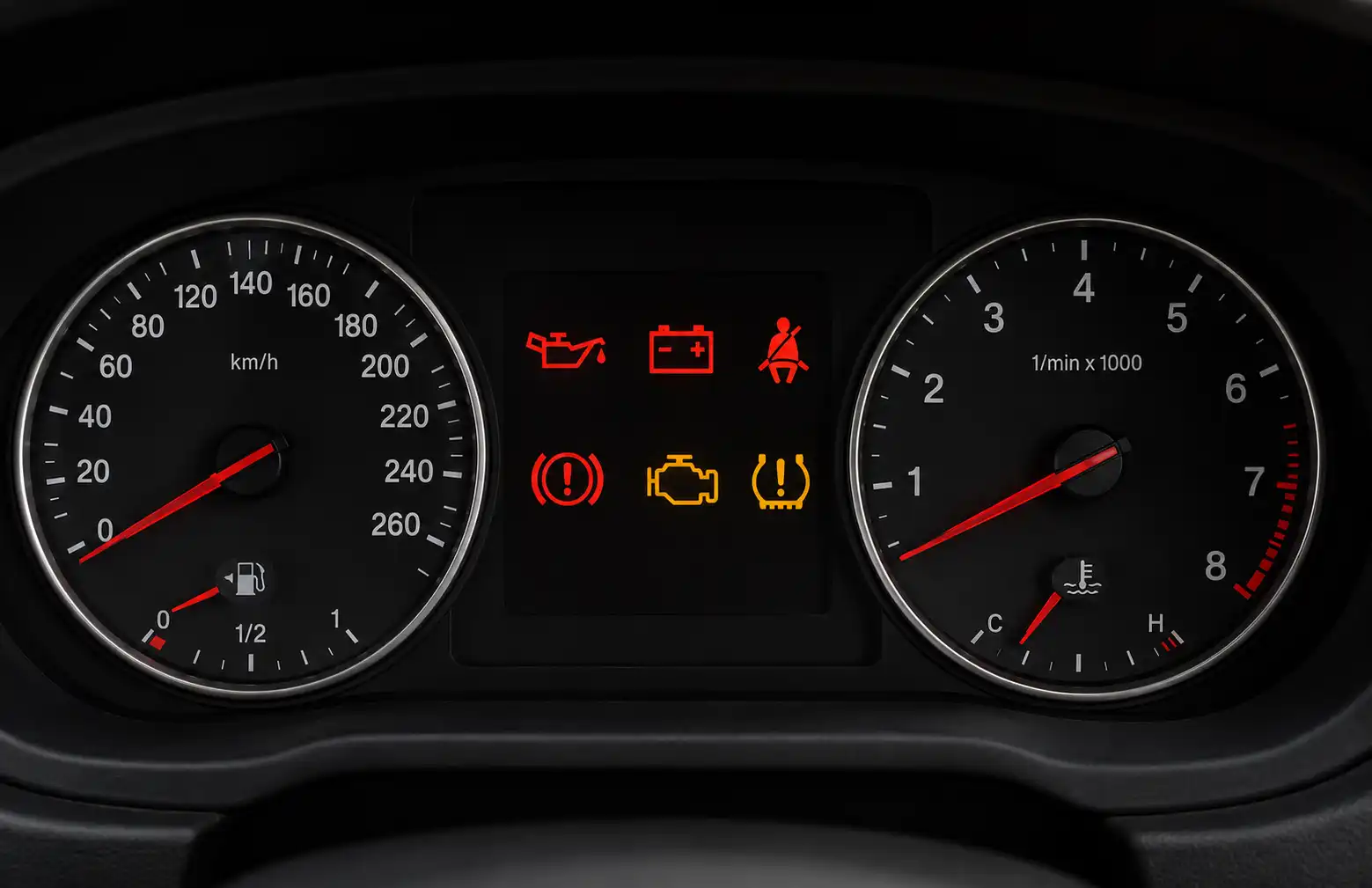 European car dashboard displaying warning lights including engine, oil pressure, battery, and brake warning indicators.